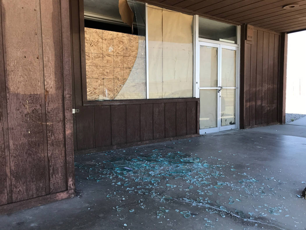 Shattered glass lies on the floor at a vacant business after an earthquake, Thursday, July 4, 2 ...