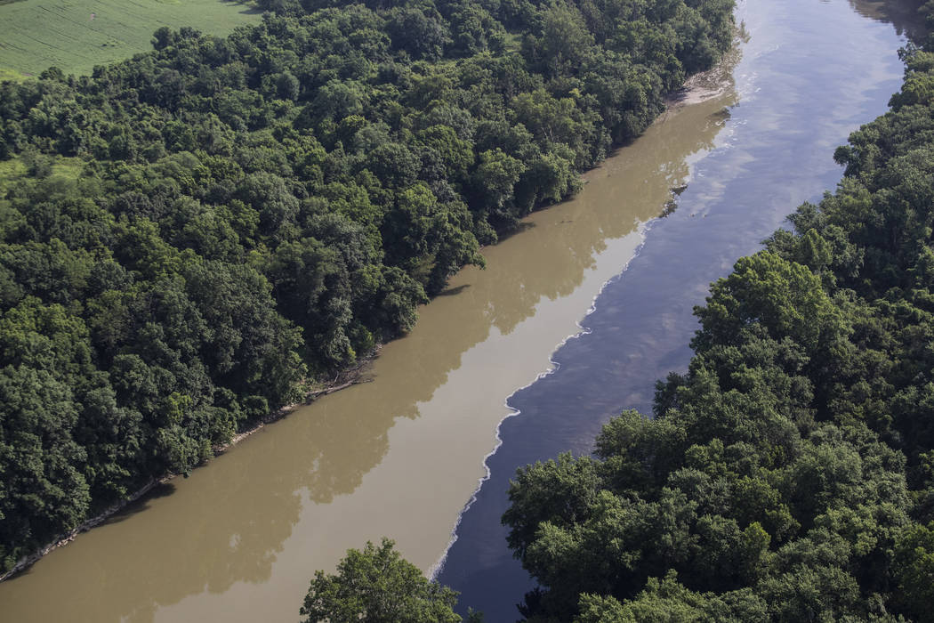 Bourbon mixes with water in the Kentucky River, Wednesday, July 3, 2019, following an overnight ...