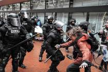 FILE - In this Monday, Feb. 20, 2017 file photo protesters clash with police, in Portland, Ore. ...