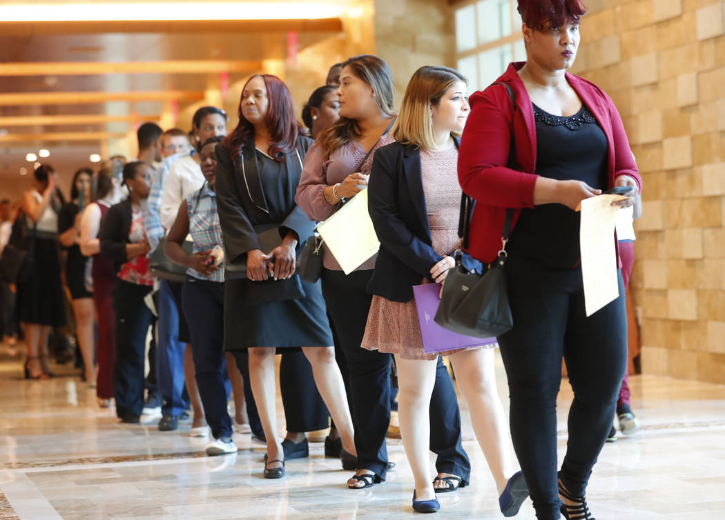 In this Tuesday, June 4, 2019 photo, job applicants line up at the Seminole Hard Rock Hotel &am ...