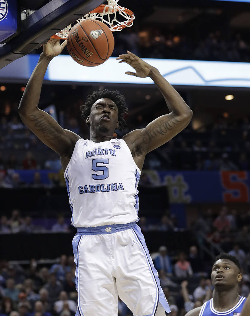 In this March 15, 2019, file photo, North Carolina's Nassir Little (5) dunks against Duke durin ...