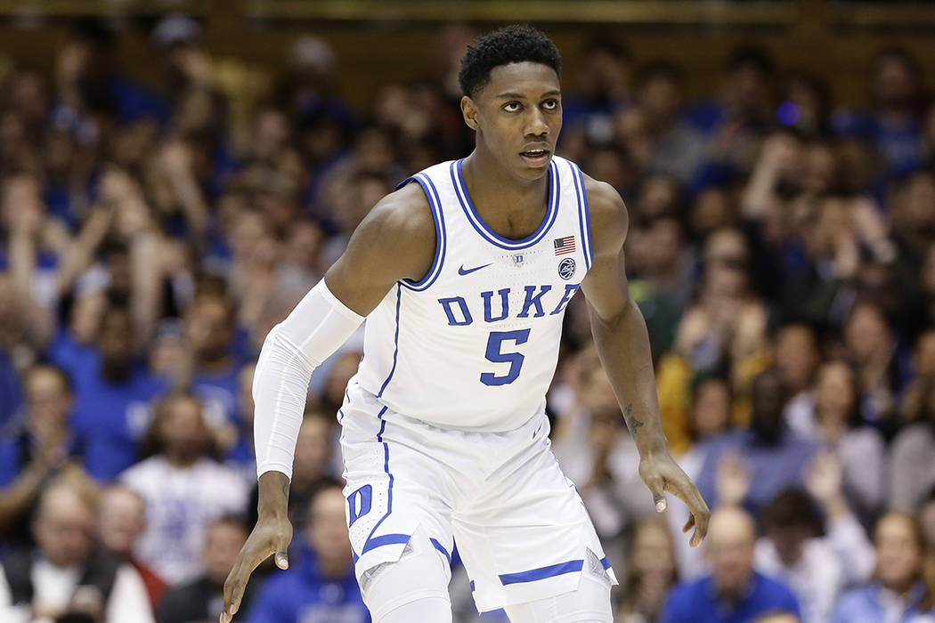 Duke's RJ Barrett (5) guards his opponent during the second half of an NCAA college basketball ...