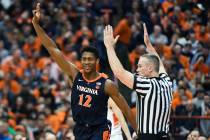 Virginia guard De'Andre Hunter celebrates a three-point basket during the second half of an NCA ...