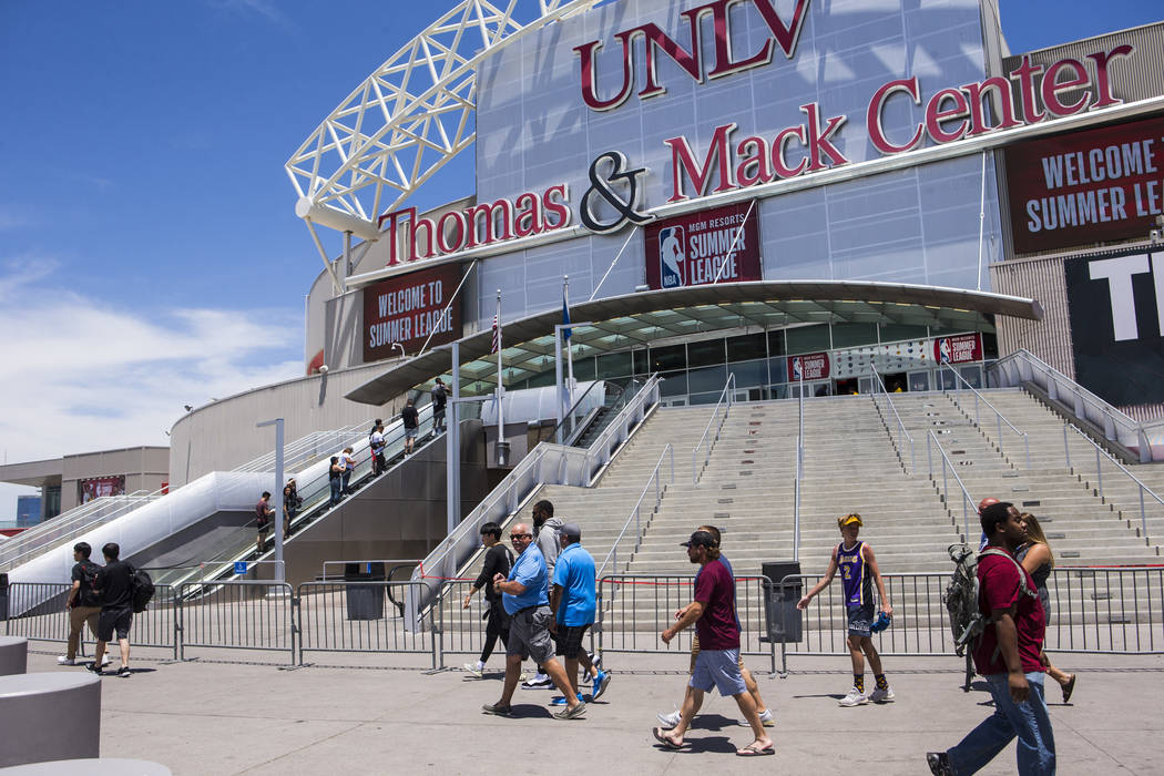 People walk outside of the Thomas & Mack Center on the opening day of Vegas Summer League i ...