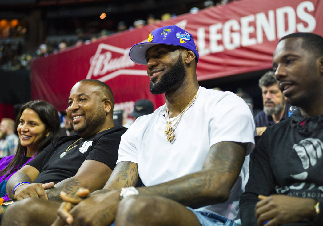 Los Angeles Lakers star LeBron James attends a basketball game between the Lakers and the Chica ...