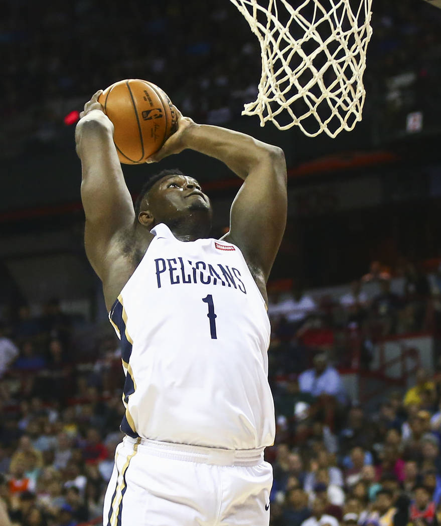 New Orleans Pelicans' Zion Williamson (1) goes to the basket to dunk against the New York Knick ...