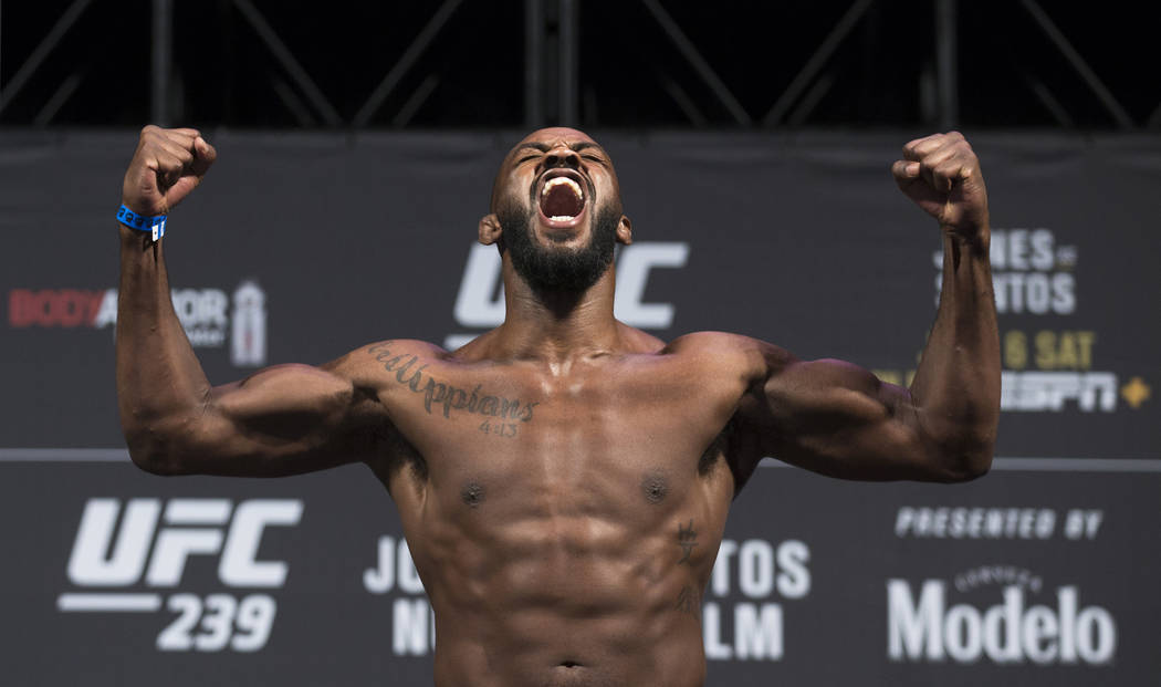 UFC light heavyweight champion Jon Jones screams into the crowd while weighing in for UFC 239 o ...