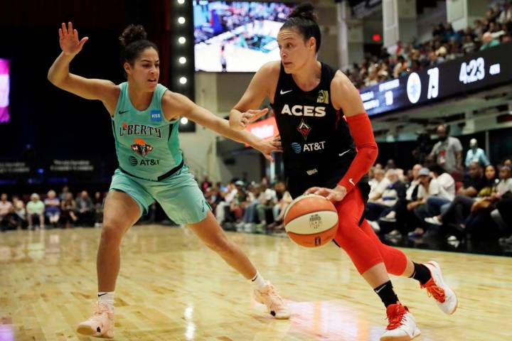 New York Liberty's Kia Nurse, left, defends against Las Vegas Aces' Kayla McBride in the second ...