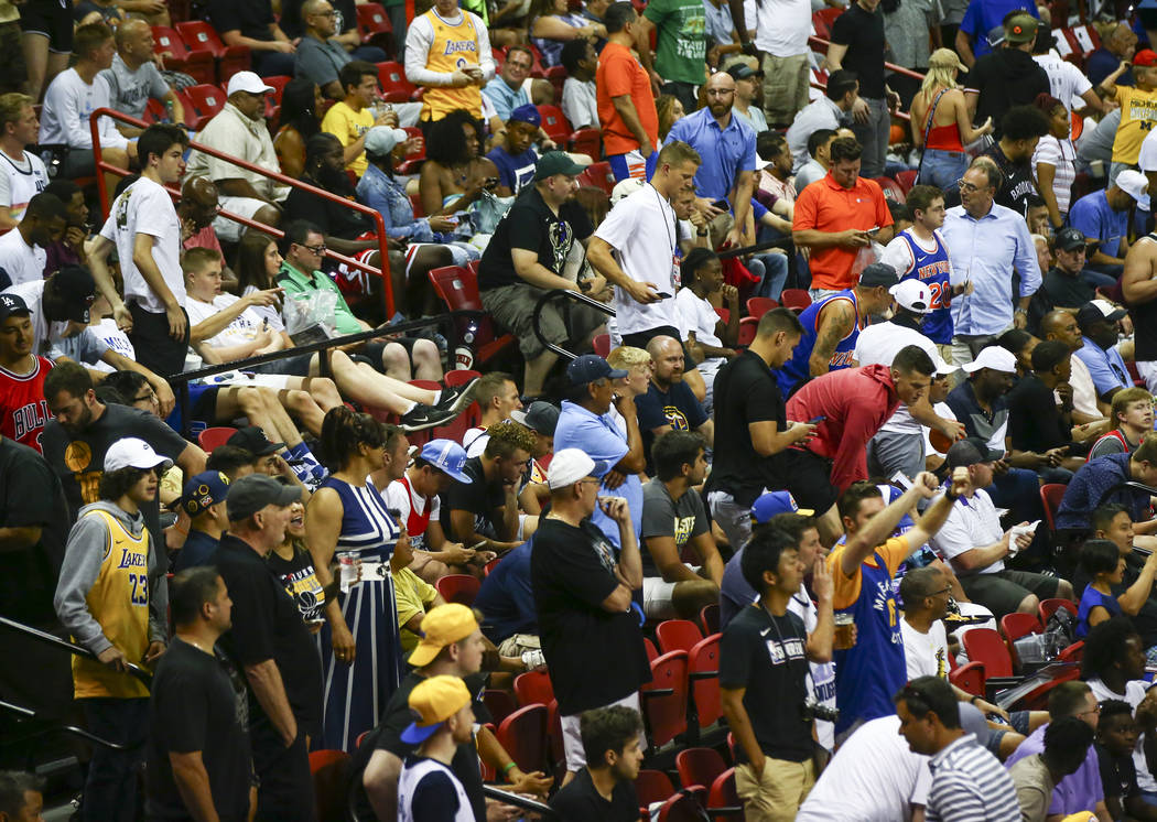 Fans react after an earthquake stopped a basketball game between the New York Knicks and the Ne ...
