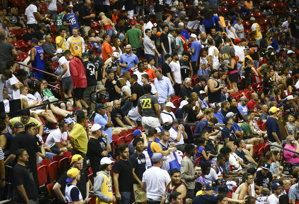 Fans react after an earthquake stopped a basketball game between the New York Knicks and the Ne ...