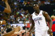 New Orleans Pelicans' Zion Williamson (1) returns to the bench as the team plays the New York K ...