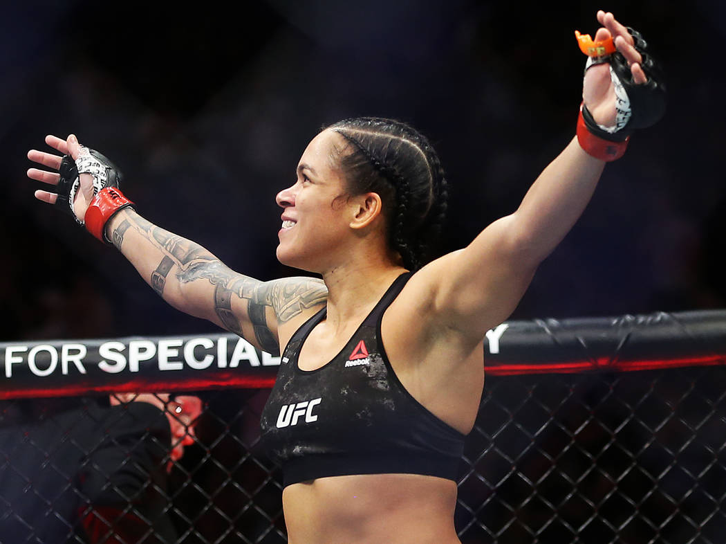 Amanda Nunes celebrates after beating Holly Holm in the first round during their bantamweight t ...