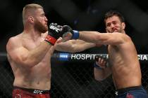 Jan Blachowicz, right, connects with a right hook against Luke Rockhold in the second round dur ...