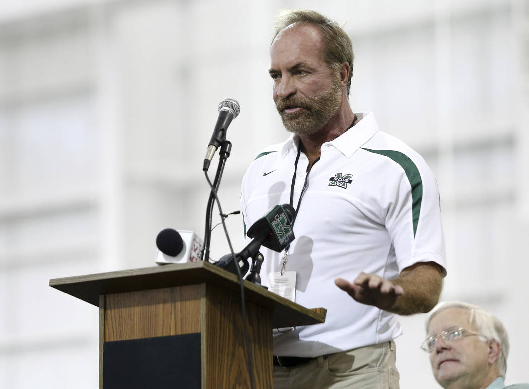 In this Sept. 6, 2014 photo, Chris Cline speaks as Marshall University dedicates the new indoor ...
