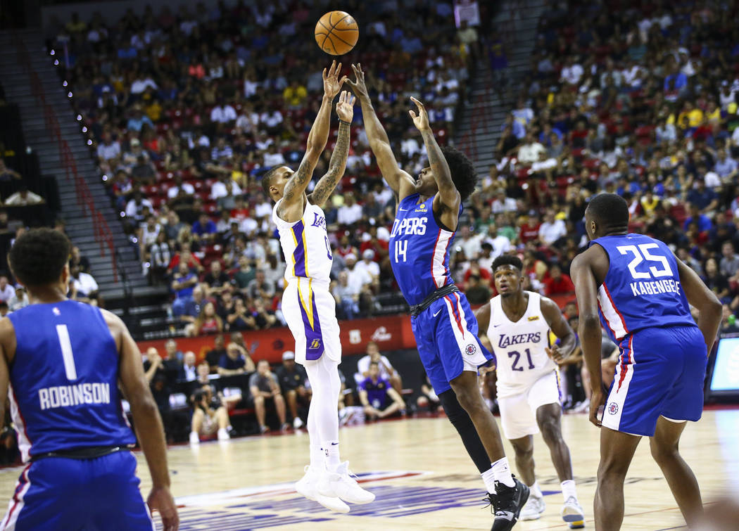 Los Angeles Lakers' Joe Young (0) shoots over Los Angeles Clippers' Terance Mann (14) during th ...