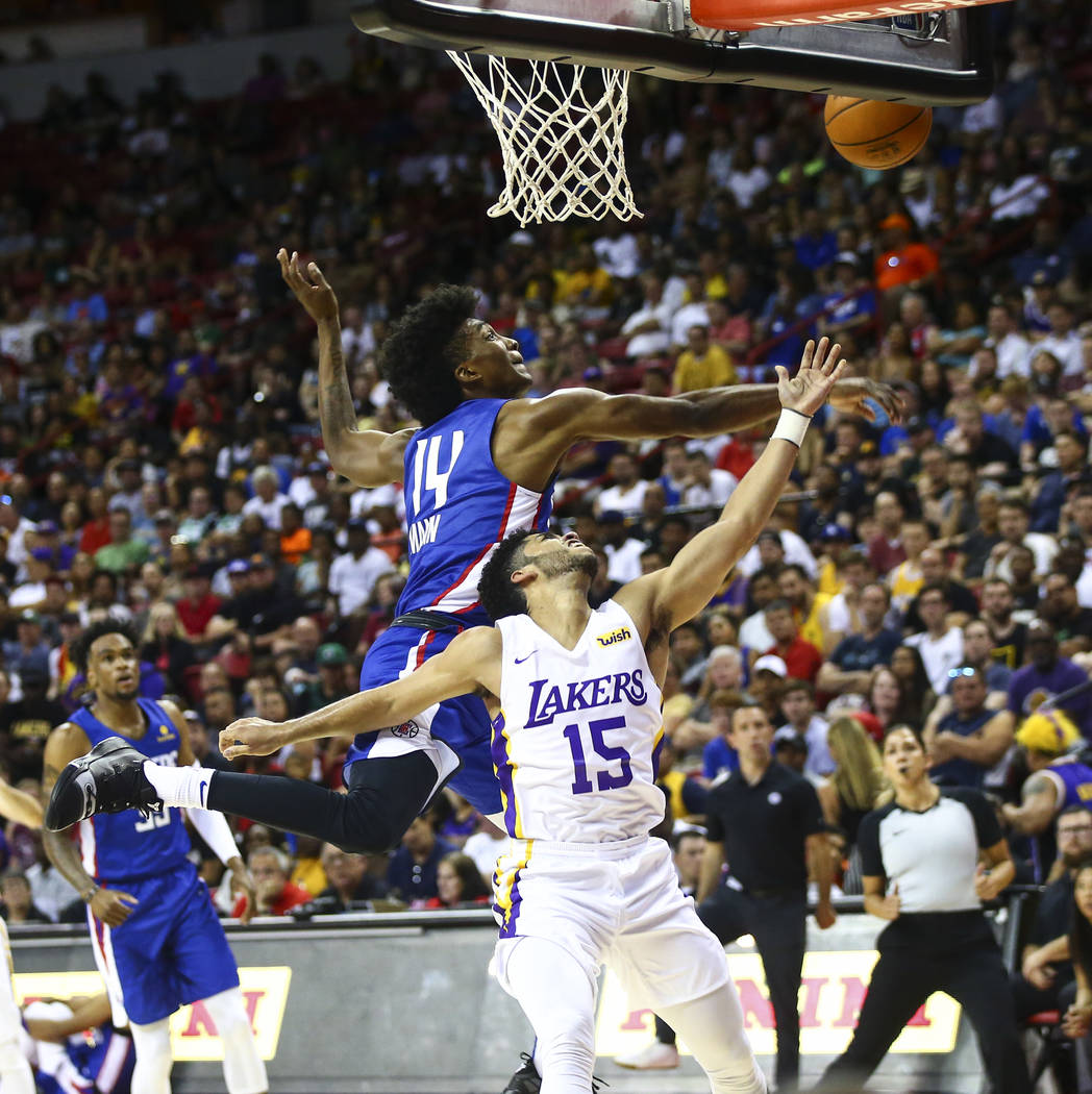 Los Angeles Clippers' Terance Mann (14) blocks a shot from Los Angeles Lakers' Jordan Brown du ...