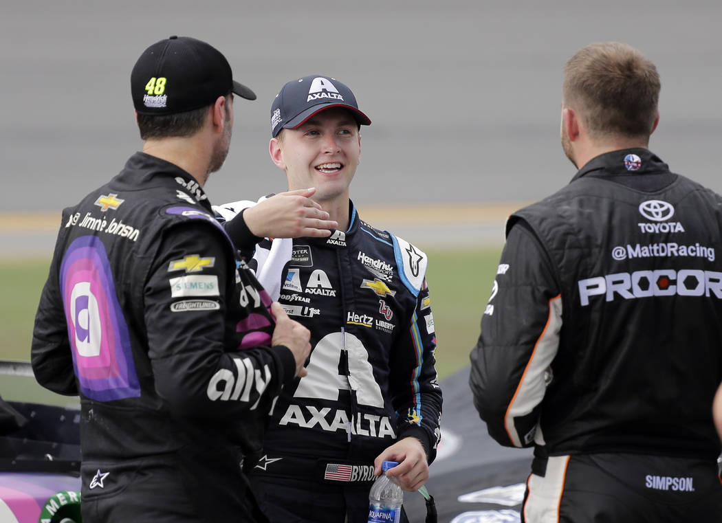 Jimmie Johnson, left, William Byron, center, and Matt DiBenedetto talk on pit road during an in ...