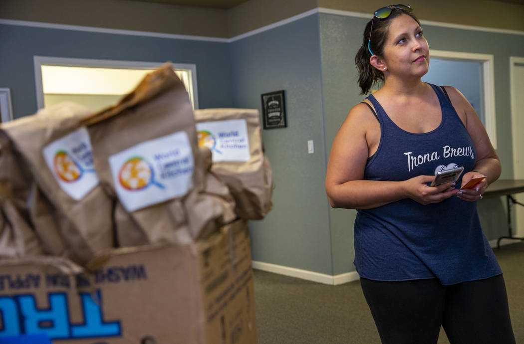 Julia Doss, president of the Trona Care, a local community group, works to coordinate the incom ...