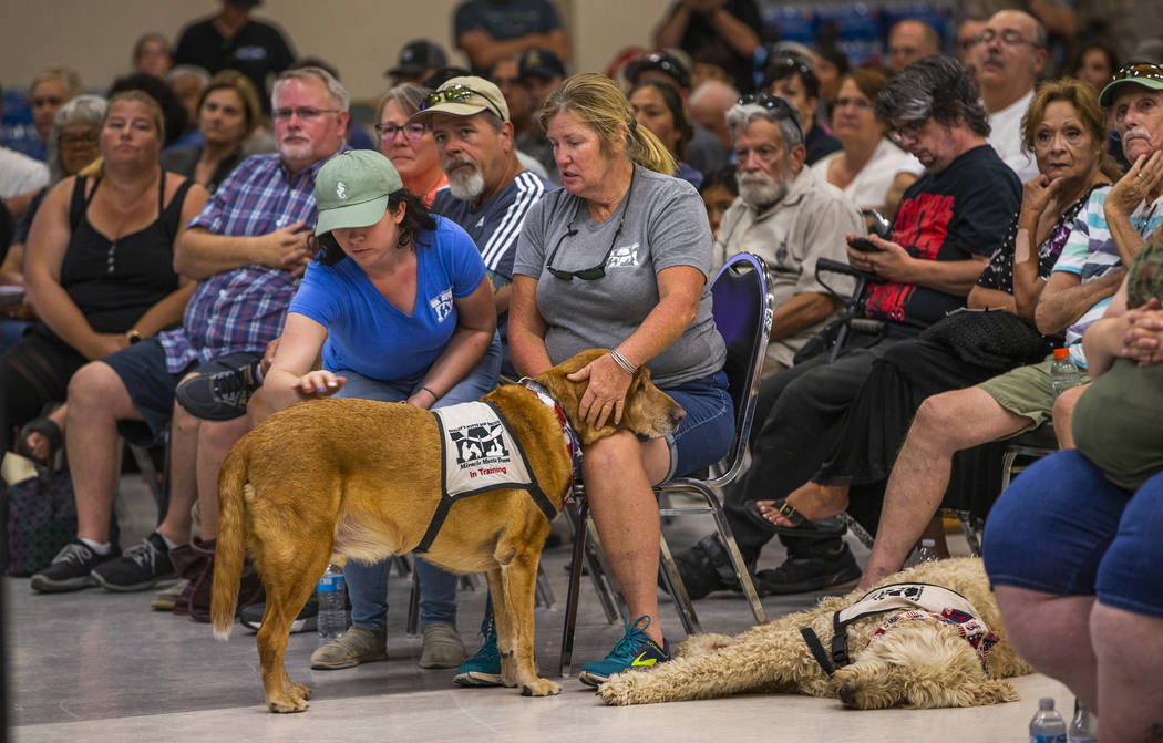 Area residents and responders gather for a town hall meeting before state and local officials w ...