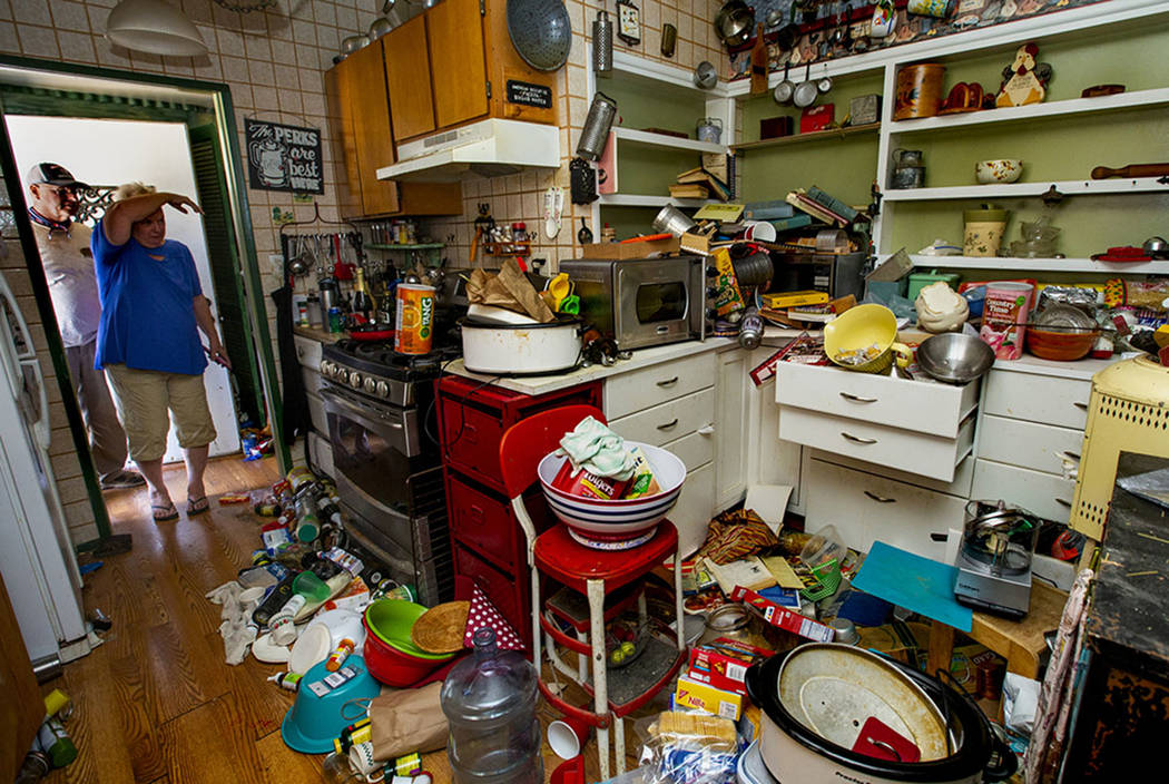 Zana Eisenhour and her husband Charlie look to their damaged kitchen from earthquake activity i ...