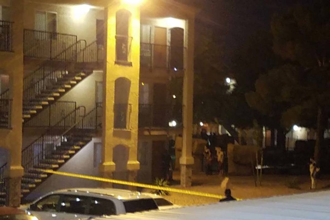 Las Vegas police investigate a fatal shooting Monday, July 8, 2019, behind a building at Emeral ...