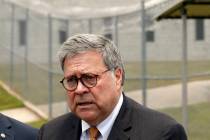 Attorney General William Barr speaks to reporters after a tour of a federal prison Monday, July ...