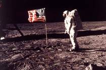 In this image provided by NASA, astronaut Buzz Aldrin poses for a photograph beside the U.S. fl ...