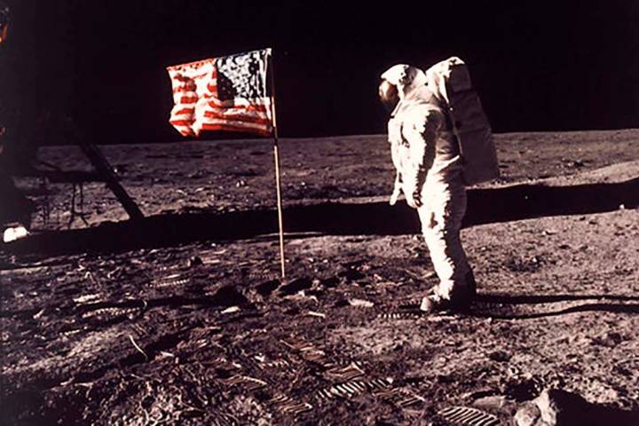 In this image provided by NASA, astronaut Buzz Aldrin poses for a photograph beside the U.S. fl ...