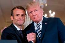 In an April 24, 2018, file photo, French President Emmanuel Macron and President Donald Trump p ...