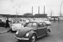 In an April 27, 1966, file photo, Volkswagen workers drive their Beetle cars from the parking l ...