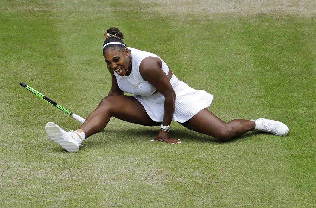 United States' Serena Williams does the splits after playing a return to United States' Alison ...