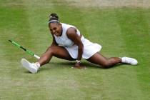 United States' Serena Williams does the splits after playing a return to United States' Alison ...