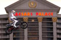 Travis Pastrana jumps over the fountains at Caesars Palace on an Indian Scout FTR750 motorcycle ...