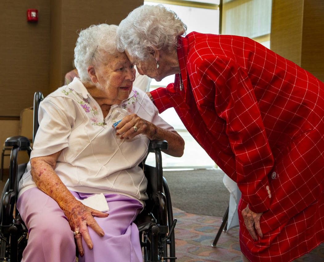 Longtime friends Mary Laub, left, and Donna Andress reconnect during a renewal of vows ceremony ...