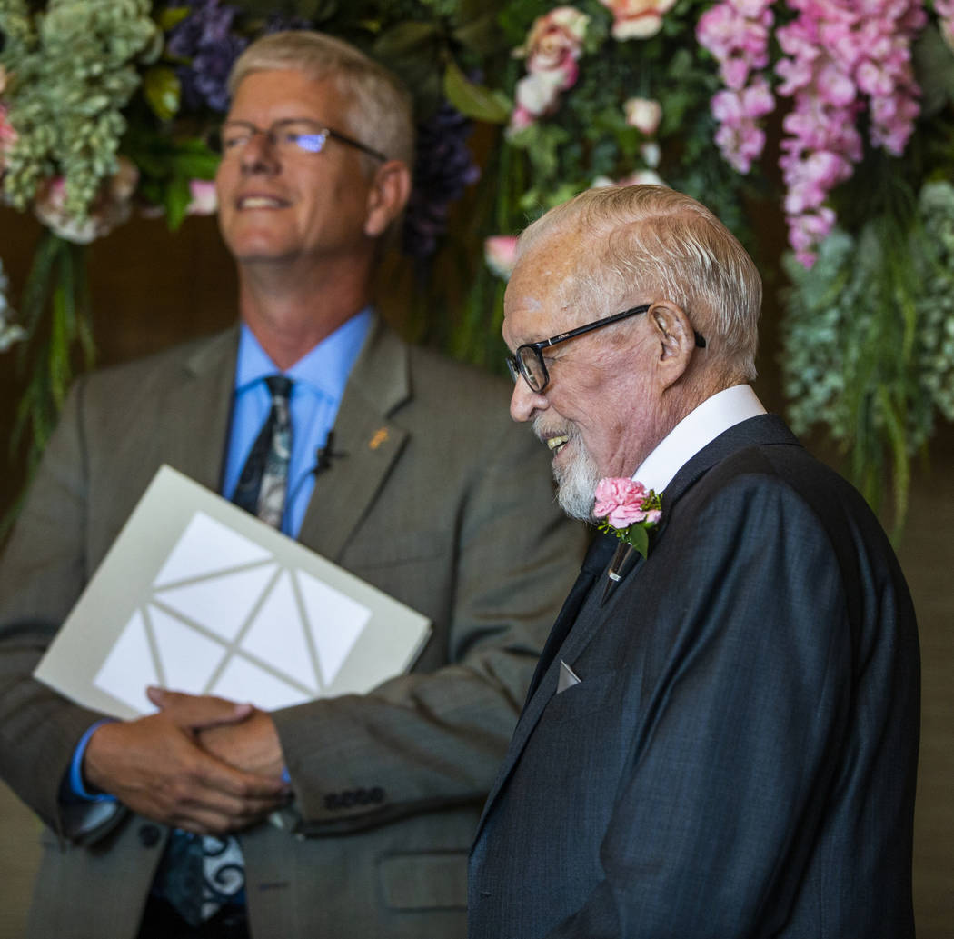 Deacon Tim O'Callaghan, left, and Gail Andress wait for Donna Andress to come down the aisle du ...
