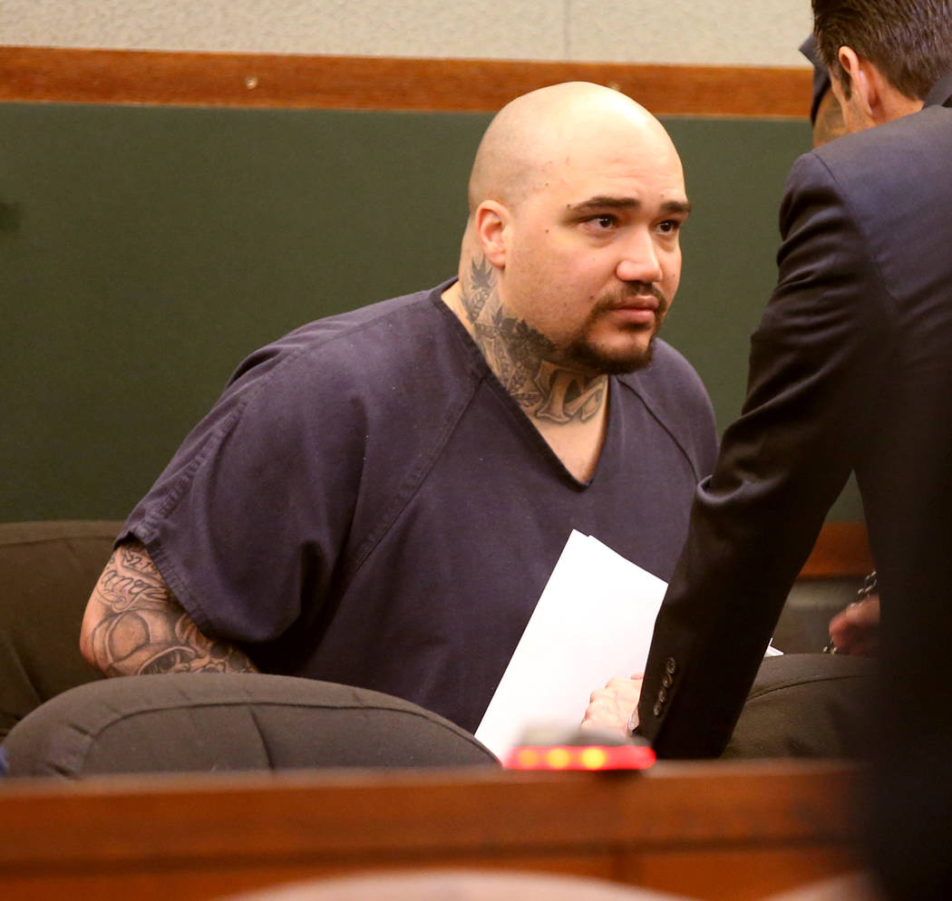 Christopher J. Weygant II, left, talks to his attorney Abel Yanez during a court appearance at ...