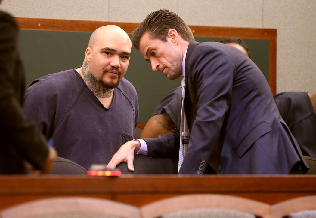 Christopher J. Weygant II, left, talks to his attorney Abel Yanez during a court appearance at ...