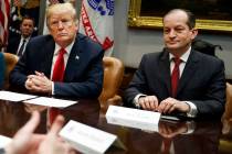 President Donald Trump, left, and Labor Secretary Alexander Acosta listen during a meeting of t ...