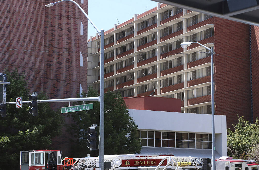 Rescue personnel respond to an explosion that damaged Argenta Hall and Nye Hall on the Universi ...