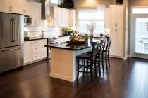 Wood tile works well in kitchens, where it is not susceptible to damage from liquid spills. (Ge ...
