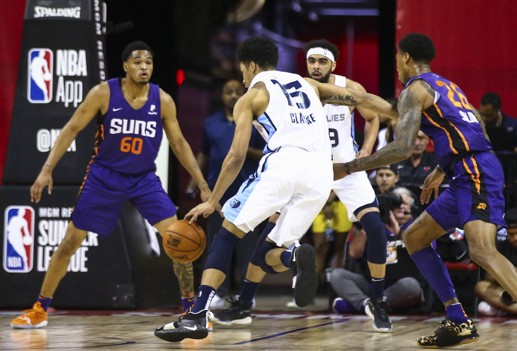 Memphis Grizzlies' Brandon Clarke (15) drives the ball against Phoenix Suns' James Palmer Jr. ( ...