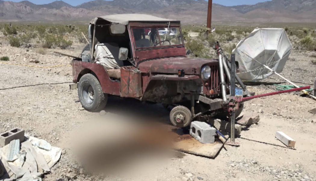 This screen shot from a video provided from Nye County Sheriff's Office shows a red, rusted Jee ...