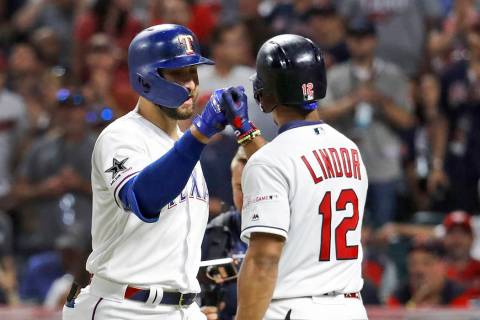 American League's Joey Gallo, left, of the Texas Rangers, is congratulated by American League t ...