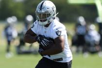 Oakland Raiders running back Josh Jacobs (28) runs with the football during an offseason traini ...