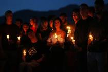 Over one hundred friends and family of Malik Noshi gather at Arbor View High School for a vigil ...