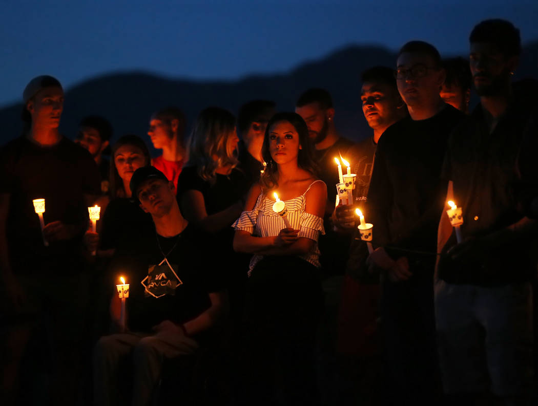 Over one hundred friends and family of Malik Noshi gather at Arbor View High School for a vigil ...