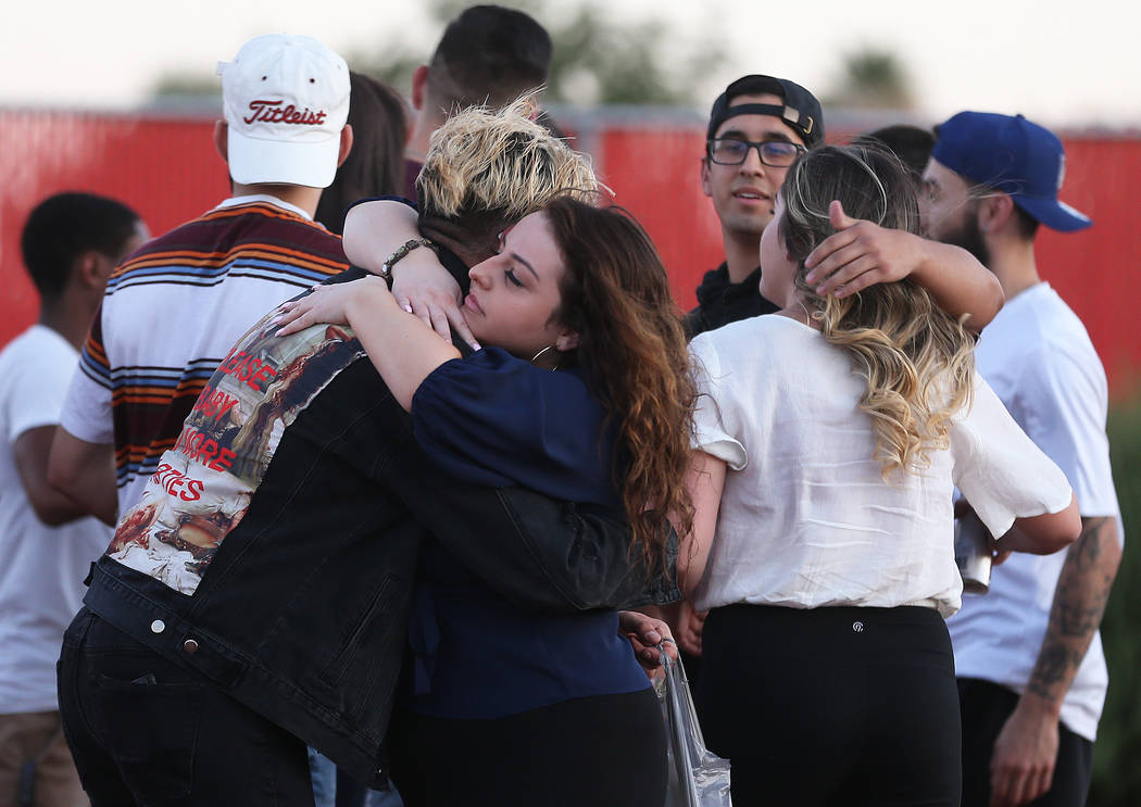 Over one hundred friends and family of Malik Noshi gather at Arbor View High School for a vigil ...