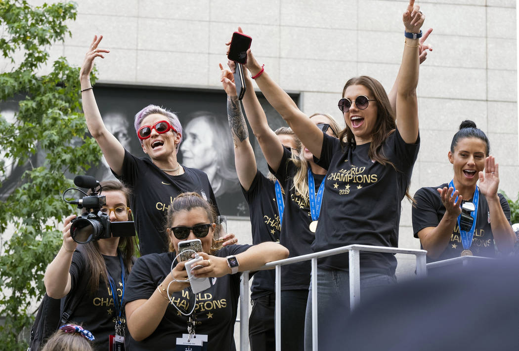 Members of the U.S. women's soccer team, including Megan Rapinoe, rear left, and Alex Morgan, r ...
