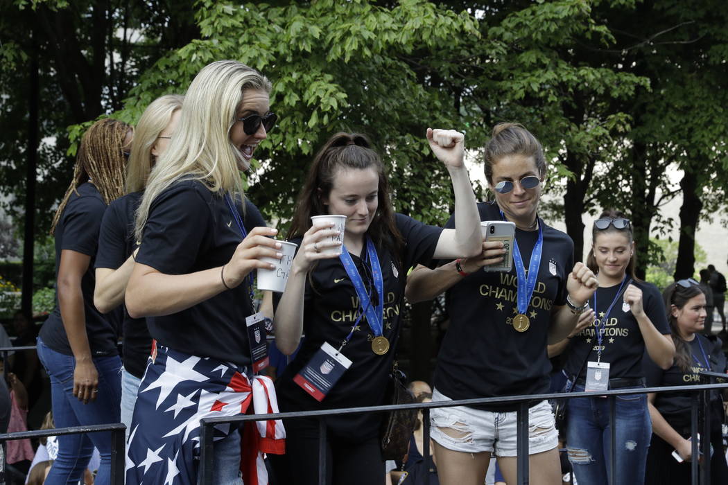 U.S. women's soccer team player Rose Lavelle, center, gestures while standing with teammates on ...