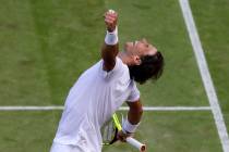 Spain's Rafael Nadal celebrates winning a men's quarterfinal match against United States' Sam Q ...